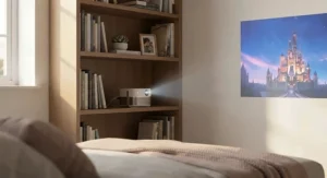 Portable mini projector sitting neatly on a bookshelf to save space in a small bedroom.