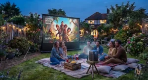 Smart portable projector paired with an outdoor projector screen for a summer garden party in the UK