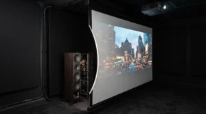 An illustration demonstrating speaker placement behind an acoustically transparent projector screen for surround sound