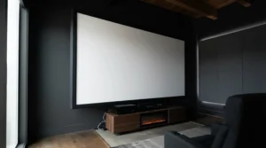 A flat fixed frame screen for dedicated cinema room offering superior flatness compared to roll-up blinds.